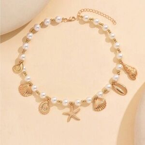 NWOT Gold and White Shell Charm Necklace